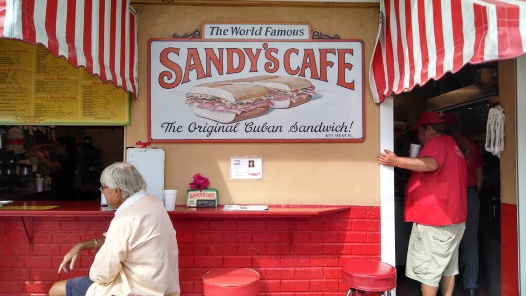 Colorful view of Sandy's Cafe serving original Cuban sandwiches in Key West, FL.