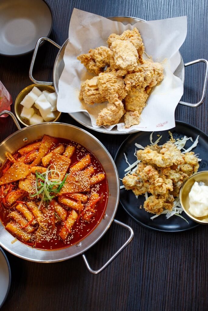 Mouthwatering Korean fried chicken paired with spicy tteokbokki for a perfect Asian fusion meal.