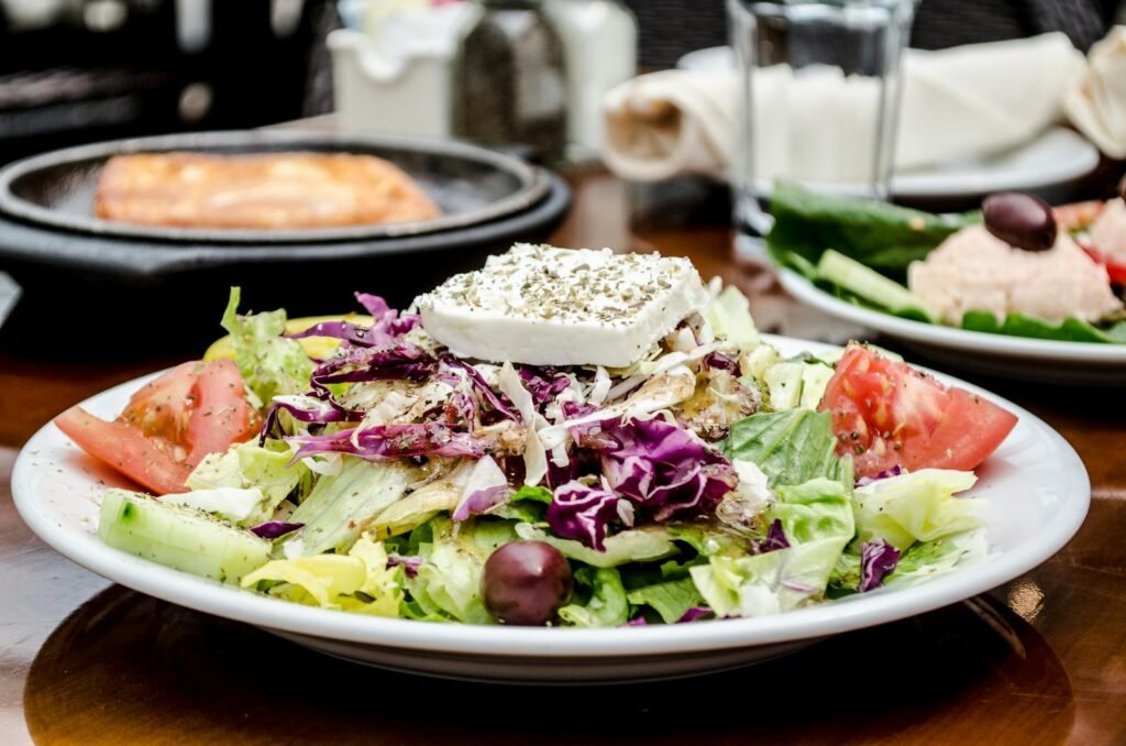 A delicious and colorful Greek salad with feta cheese, tomatoes, and olives, perfect for a healthy meal.