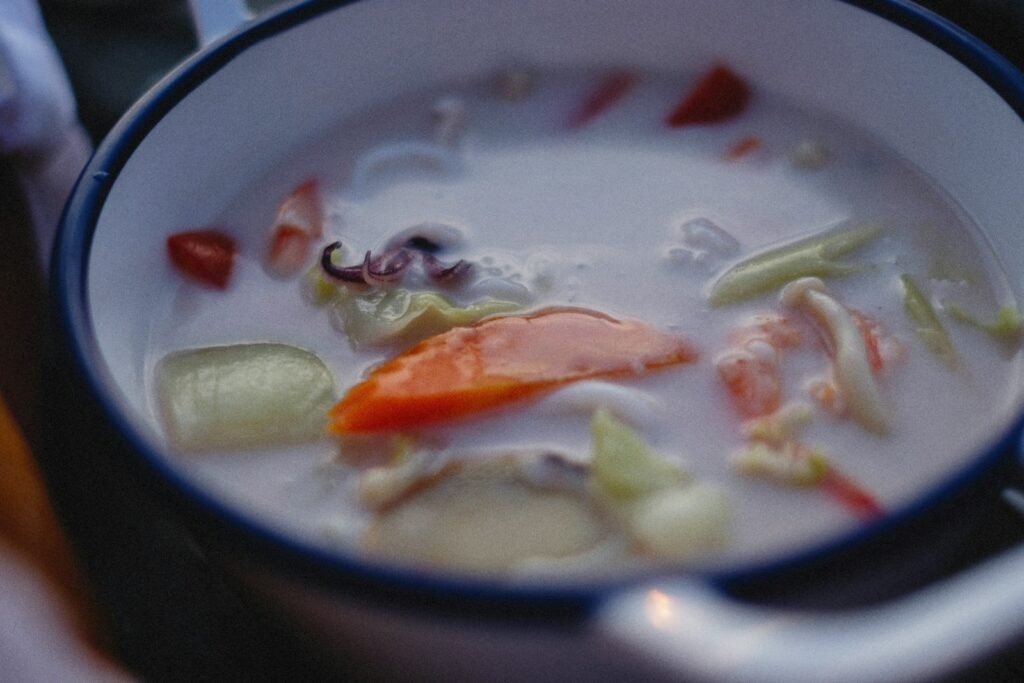 a close up of a bowl of soup on a table