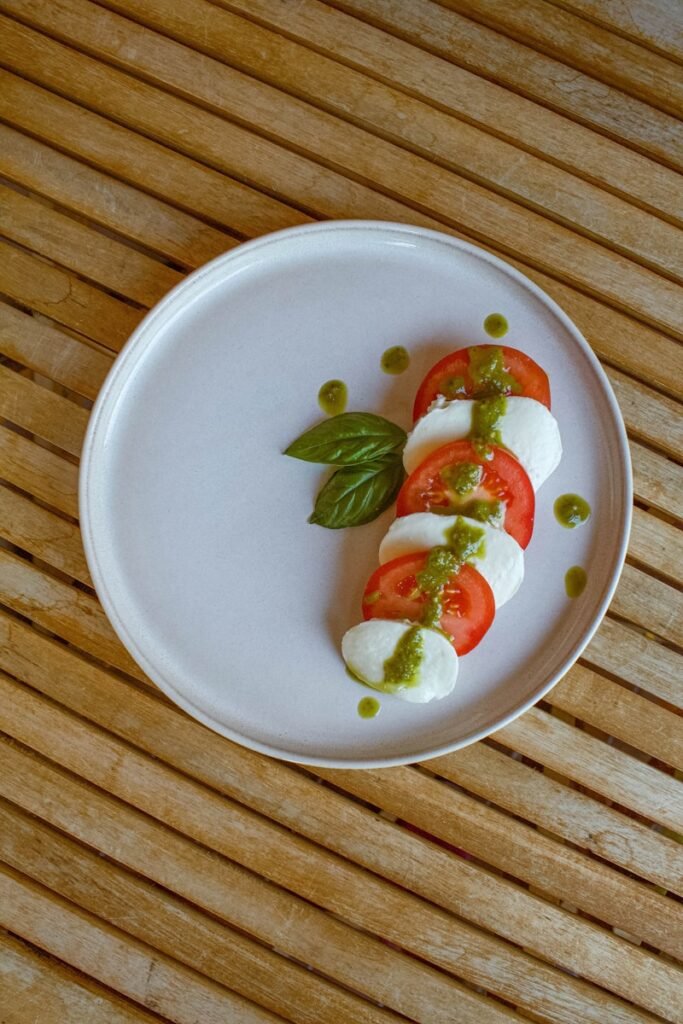 A white plate topped with food on top of a wooden table