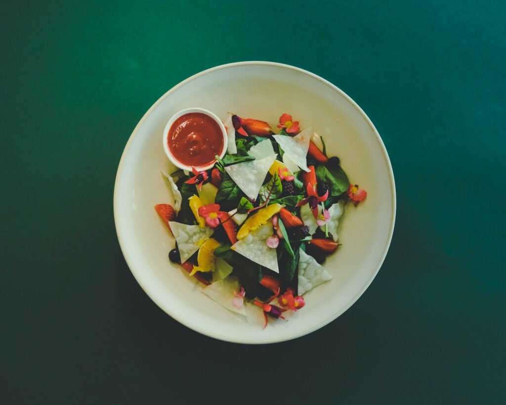 vegetable salad on white ceramic bowl