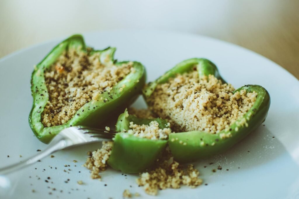 Delicious stuffed green bell pepper with couscous, perfect for a healthy vegetarian meal.