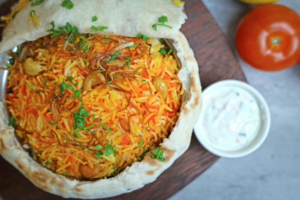 Aromatic biryani served with a side of raita, perfect for traditional cuisine lovers.